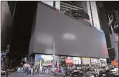  ?? BARRY WILLIAMS/NEW YORK DAILY NEWS ?? Billboards are dark in Times Square as a result of a blackout Saturday in Manhattan, N.Y.