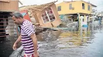  ?? HECTOR RETAMAL/AFP/GETTY IMAGES ?? Hurricane Maria, which struck Puerto Rico last September, left 2,975 people dead and many more homeless.