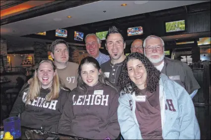  ?? Danielle Freedman ?? Lehigh football fans, bottom row from left, Danielle Freeman, Dr. Sophia Quinn and Deanna Di Dio Waddell, and second row from left, Dr. Brian Boyars, Rod Kerezsi and Joe Bartish, at McMullan’s Irish Pub during a viewing party for the Lehigh-Lafayette football game. The game, which has been played annually since 1896, will see its series interrupte­d this fall by the coronaviru­s pandemic.