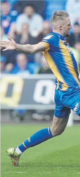  ?? ?? Blues attacker Reeco Hackett attempts to turn away from an opponent during the 1-1 draw at Shrewsbury on Saturday