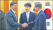  ?? AP/Yonhap/LEE JIN-WOOK ?? South Korean President Moon Jae-in (right) greets U.S. Defense Secretary Mark Esper before a meeting Friday at the presidenti­al Blue House in Seoul.