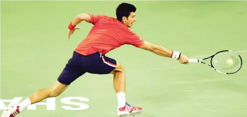  ?? PHOTO
AFP ?? Novak Djokovic of Serbia reaches for a return during his men’s singles final against Jo-Wilfried Tsonga of France at the Shanghai Masters tennis tournament in Shanghai, yesterday.