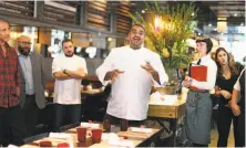  ?? Scott Strazzante / The Chronicle 2017 ?? The restaurant group headed by award-winning chef Michael Mina (center) did not properly compensate employees for hours worked, a lawsuit filed in San Francisco alleges.