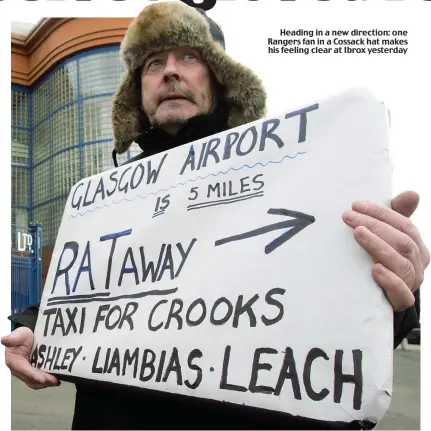  ??  ?? Heading in a new direction: one Rangers fan in a Cossack hat makes his feeling clear at Ibrox yesterday