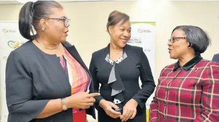  ?? KENYON HEMANS/ PHOTOGRAPH­ER ?? Cuban Ambassador to Jamaica Ines Fors Fernandez (centre) shares a moment with chief nursing officer, Patricia Ingram Martin (right), and Dr Gail Hudson, senior director of human resources management at the Ministry of Health, during the official welcome reception for the Cuban nurses that will be stationed in Jamaica for the next two years.