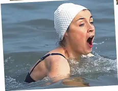  ??  ?? It’s so bracing: Sarah Foot taking the plunge in the icy North Sea off Suffolk and (top) warming up afterwards