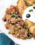  ?? ?? Instant Pot Mexican rice with black beans makes a great side dish served with enchiladas.