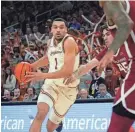  ?? SARA DIGGINS/AMERICAN-STATESMAN ?? Texas forward Dylan Disu drives into the key in the first half of Saturday’s game against Oklahoma at the Moody Center in Austin, Texas.