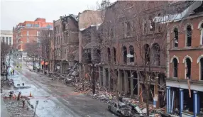  ?? ANDREW NELLES/THE TENNESSEAN ?? Damage is seen along 2nd Ave. N. in downtown Nashville on Dec. 31, 2020. Anthony Quinn Warner, 63, was killed when he detonated an explosive in his RV outside an AT&T building on Christmas morning.