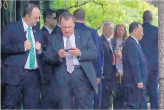  ?? JULIO CORTEZ/ASSOCIATED PRESS ?? Kim Yong Chol, right, N. Korea’s former military intelligen­ce chief and a close aide to Kim Jong Un, walks out of a building after a meeting with U.S. Secretary of State Mike Pompeo on Thursday.