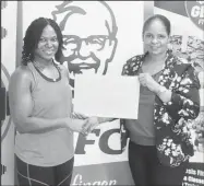  ?? ?? Marketing Manager of KFC Pamela Manasseh presenting the sponsorshi­p cheque to Noshavyah King.