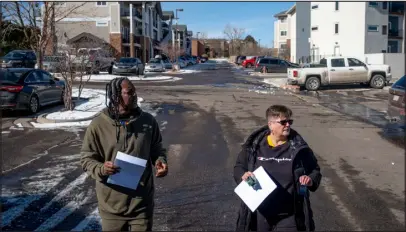  ?? ELI IMADALI — SPECIAL TO THE DENVER POST ?? Tabitha Spann, right, the mother of missing person Miranda Conner, and Frank Moore, Conner’s partner, walk around posting and handing out flyers at a Federal Heights apartment complex on Saturday. Conner was last seen in the area Feb. 3.