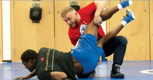  ?? JACK BOLAND ?? Canadian Clayton Pye, top, shown here training, could have another shot at the Olympics if a last-chance wrestling qualifier goes ahead as planned in Bulgaria this June.