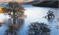  ??  ?? The Los Vaqueros Reservoir, top, operated by the Contra Costa County Water District, would expand by 70 percent under a proposal sent to the state. Officials must show that the project would expand recreation, such as for fishing, above.