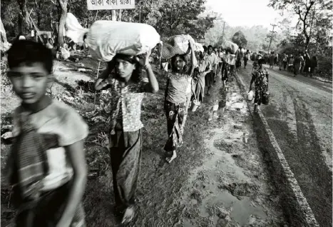  ??  ?? ‘Hundreds of thousands of Rohingya have flooded into southern Bangladesh over the past month after violence erupted in the Burmese state of Rakhine. The north-south highway between the Bangladesh­i cities of Teknaf and Cox’s Bazar is a steady flow of...