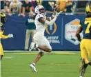  ?? RICK SCUTERI/AP ?? TCU wide receiver Quentin Johnston (1) makes a catch against Michigan during the College Football Playoff semifinal at the Fiesta Bowl on Dec. 31 in Glendale, Arizona.