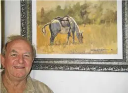  ?? Picture: BOB FORD ?? LOVE OF NATURE: Well-known artist Bob McKenzie with one of the many impressive paintings he has on display at his Port Alfred McKenzie Art Gallery in Wharf Street