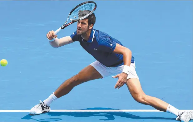  ??  ?? FRESH PERSPECTIV­E: Serbia’s Novak Djokovic reaches for a forehand while playing this week at Kooyong with his elbow wrapped.