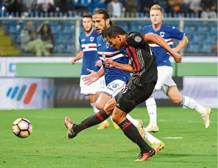  ??  ?? Right on target: AC Milan’s Carlos Bacca scoring against Sampdoria during the Serie A match at Luigi Ferraris Stadium in Genoa on Friday. — EPA