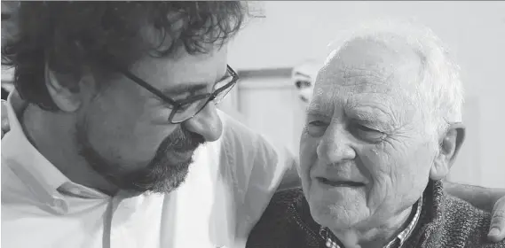  ??  ?? Italian musicologi­st Francesco Lotoro speaks with Holocaust survivor and film director Jack Garfein. Lotoro has devoted his life to unearthing songs and scores written during the Holocaust.