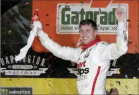  ?? TERRY RENNA — THE ASSOCIATED PRESS ?? Denny Hamlin celebrates in Victory Lane after winning the NASCAR Monster Cup auto race at Darlington Raceway, Sunday in Darlington, S.C.