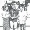  ??  ?? Bryan Nonay (center) receives the Best Play award for his piece ‘ B’yaheng Gen. X, Gen. Y, atbp.’ with Dulaang Filipino member Pam Darroca (left) and Office of Culture and Arts Cultural Events Promotion Coordinato­r Julia Enriquez- Cristobal (right)