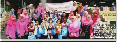  ??  ?? ANAK-anak yatim dan kurang berkemampu­an bergambar bersama Noorhayati serta ahli jawatankua­sa dalam Program Shopping Raya.