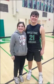  ?? Contribute­d photo ?? Amyra Mahik, 12, of Pipestone, Minn., wears a Paige Bueckers hoodie next to her brother, Breylon.