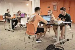  ??  ?? Oklahoma State University’s newly renovated Parker Hall includes this new Student Excellence Center in the basement. Students seen in the center are, from left, Christophe­r Fenton of Overland Park, Kan., Rylee Hunter of Olathe, Kan., Cole Egan of Flower Mound, Texas, Emily Whisman of Frisco, Texas, and Bailey James of Muskogee. The College of Engineerin­g, Architectu­re, and Technology has moved all its livinglear­ning communitie­s into Parker Hall this year.