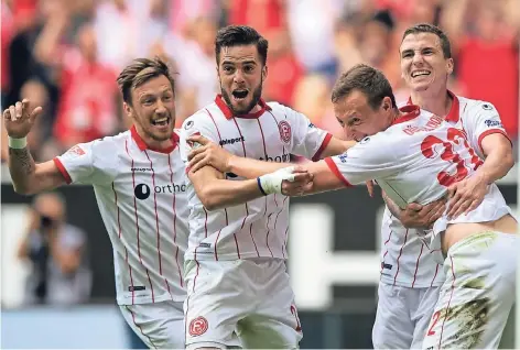  ?? FOTO: DPA ?? Der befreite Jubel nach dem Treffer zum 3:0 gegen Ingolstadt, der die letzten Zweifel am Sieg beseitigt: (von links) Adam Bodzek, Niko Gießelmann, Torschütze Robin Bormuth und Marcel Sobottka feiern den wichtigen Erfolg der Düsseldorf­er Fortuna.