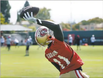  ?? KARL MONDON — STAFF PHOTOGRAPH­ER ?? 49ers wide receiver Marquise Goodwin, who makes a one-handed grab during training camp, is on track for a spot in the starting lineup.