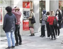 ?? File/AFP ?? People line up to retrieve money from a bank ATM in Ankara.