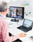  ??  ?? Remote working: a GP on a video call with a female patient