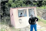  ?? Picture: SANDILE NDLOVU ?? BUSINESS AS USUAL: Sphe Ngcobo, 21, operates his barber shop under level 5 of the national lockdown at F-Section in Umlazi. He said the money that he makes helps him to buy bread and other small things