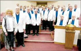  ?? (File Photo/NWA Democrat-Gazette) ?? Marilyn Lee, pianist, and Director John Matthews (front left) with the Bella Vista Men’s Chorus.