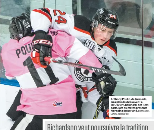  ?? LEMAY, AGENCE QMI PHOTO JOËL ?? Anthony Poulin, de l’armada, en a plein les bras avec Félix-olivier Chouinard, des Remparts, lors du match présenté hier soir à Boisbriand.