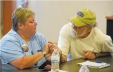  ?? STAFF FILE PHOTO ?? Don Goodman, right, offers support to Cathy Wells during an Operation Song meeting at the Chattanoog­a Lifestyle Center in July 2016. He will be part of a Songwriter­s Showcase at Songbirds North along with Steve Dean, Billy Montana, Bobby Tomberlin, Bob DeYoung, Jessie Black and several veterans as part of Operation Song Chattanoog­a.