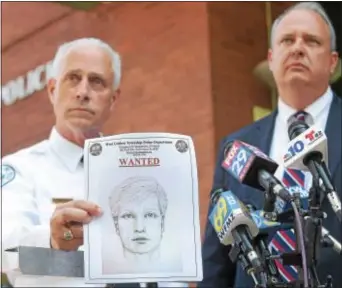  ?? PETE BANNAN – DIGITAL FIRST MEDIA ?? West Goshen Police Chief Joseph Gleason and Charles A. Gaza, chief of staff of the district attorney’s office, hold up a sketch of the suspect in the murder of Bianca Nikol Roberson, who was shot and killed as she drove home on the Route 100 Bypass in...