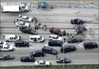  ?? BRUCE R. BENNETT / THE PALM BEACH POST ?? This aerial photo shows the chaotic scene Wednesday on Interstate 95 near Lantana, where a man drove the wrong way down the road, causing crashes, before being shot dead.