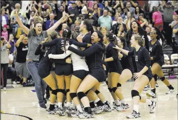  ?? Richard Brian Las Vegas Review-Journal @vegasphoto­graph ?? Shadow Ridge celebrates its Class 4A state girls volleyball title after defeating Bishop Gorman in five sets on Saturday at Faith Lutheran High.