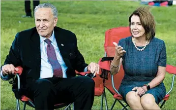  ?? JOSE LUIS MAGANA/AP ?? Senate Minority Leader Chuck Schumer and House Minority Leader Nancy Pelosi talk Thursday with so-called Dreamers.