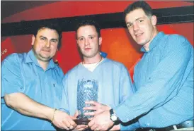  ?? ?? Gary Mahon (Ballyshann­on, Co Donegal and Fermoy, Co Cork), winner of the Karaoke competitio­n at Mac’s Bar, Fermoy, receiving his prize from proprietor, Noel McCarthy (left) and Barry O’Neill, representi­ng sponsors Guinness. Head chef at Charlie Browne’s Bar and Restaurant 21 years ago, Gary performed 2 songs - ‘Rockin’ Robin’ and ‘Run Around Sue’ - much to the delight of his adoring fans.