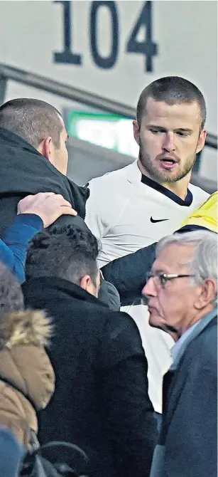  ??  ?? Face-off: Eric Dier climbed 10 rows of seats to find the fan in the West Stand