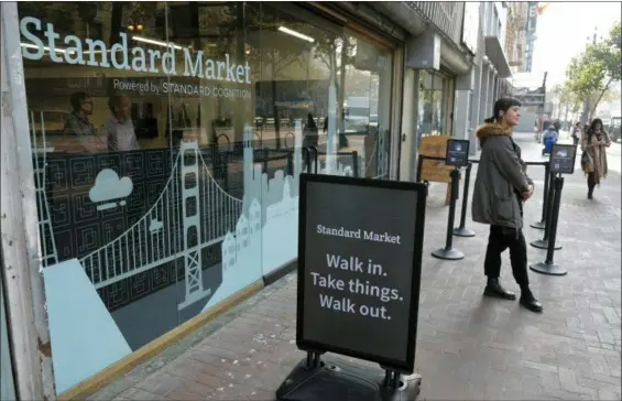  ?? ERIC RISBERG — THE ASSOCIATED PRESS ?? This photo shows the Standard Cognition cashier-less store on Market Street in San Francisco. Get ready to say good riddance to the checkout line. A year after Amazon opened its first cashier-less store, startups and retailers are racing to get similar technology in other stores throughout the world, letting shoppers buy groceries without waiting in line.