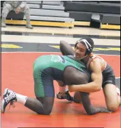  ?? STAFF PHOTO BY AJ MASON ?? North Point’s Elijah Griggs takes down R.J. Burrell of St. Charles in the 170-pound weight class in Tuesday night’s SMAC wrestling match. Griggs won on a pin midway through the second period.