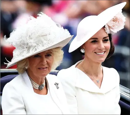  ??  ?? family: Above, Camilla with Kate Middleton at last year’s Trooping the Colour; Clockwise from left: Camilla with her children Tom and Laura at the Cheltenham Festival in 2015; Laura with her son Gus in 2011, and Camilla with her sister Annabel and...