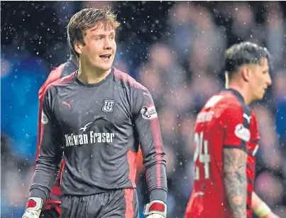  ?? Picture: SNS. ?? Young Dark Blues goalkeeper Calum Ferrie made his debut against Rangers at Ibrox.