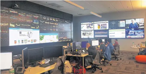  ?? REUTERS ?? Walmart employees work at the company’s network operations centre in Sunnyvale, California.