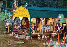  ?? CONTRIBUTE­D BY FRED SCRUTON ?? SamG’s studio is meant to look like “a giant space slug,” and he calls it the mothership. His creative compound in the woods behind a gas station has been named in the book “A Guide to the South’s Quirkiest Roadside Attraction­s.”