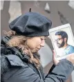  ?? POSTMEDIA NEWS ?? Maral Gorginpour stands out front of her Toronto home with a portrait of her husband who was killed when Ukraine Airlines Flight PS752 was shot down by the Iranian military days after they were married.